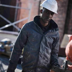 Construction worker wearing the RG045 Waterproof Jacket from T Shapes, designed for durability and customisation.