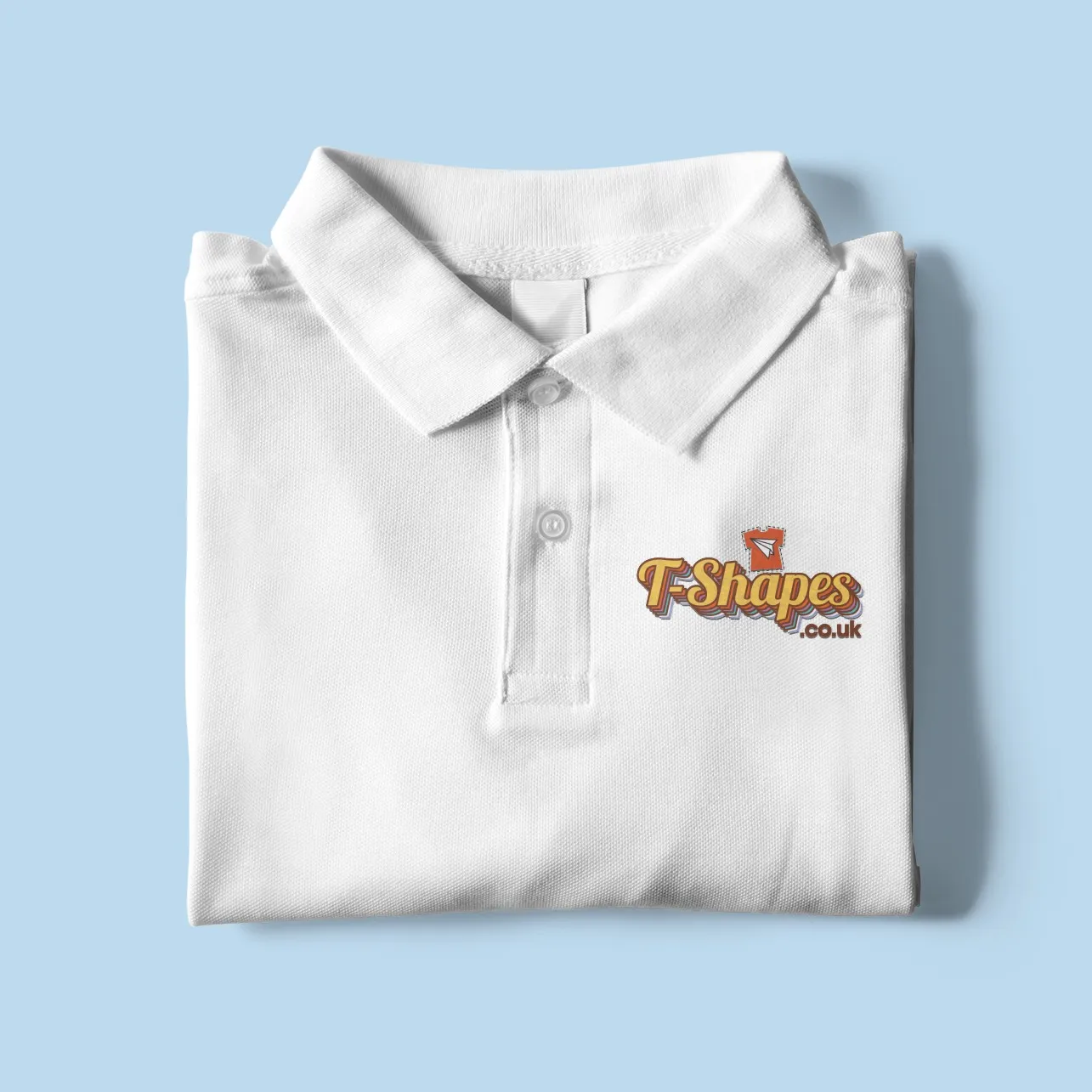 Folded white polo shirt with T-Shapes embroidered logo