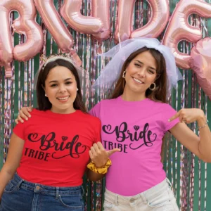 Two women wearing Bride Tribe T-shirts at a hen party